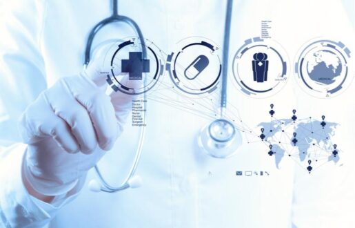 A hand wearing white gloves reaches out to tap symbols on a digital screen. The individual wears a white coat and a stethoscope and the image is meant to imply the digitization of the healthcare profession.