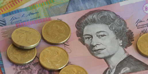 Image of Queen Elizabeth on a Australian banknote with separate dollar coins.