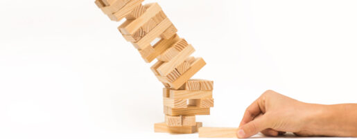 Wooden Jenga tower about to collapse.