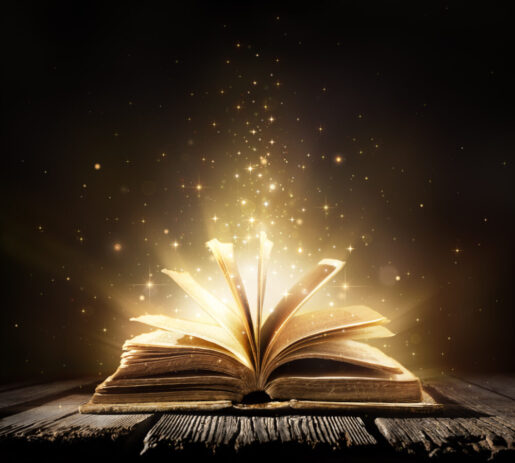 A book opens and magic and gold dust jump out of it