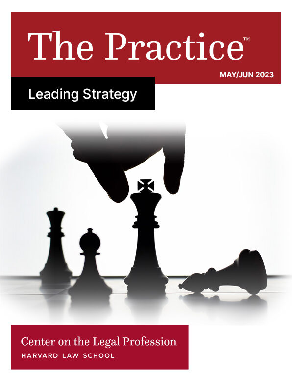 The cover of the May/June 2023 issue of the Practice magazine from the HLS Center on the Legal Profession on "Leading Strategy" shows a hand reaching down to move a chess piece and one chess piece fallen on its side.