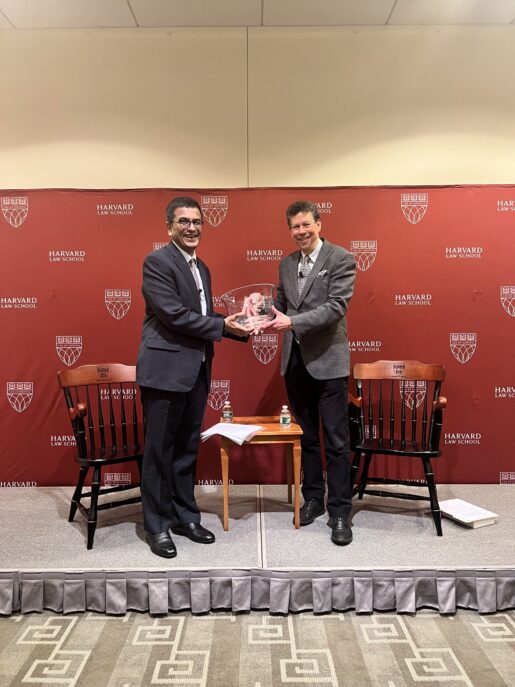 Chief Justice Chandrachud accepts an award from David Wilkins.