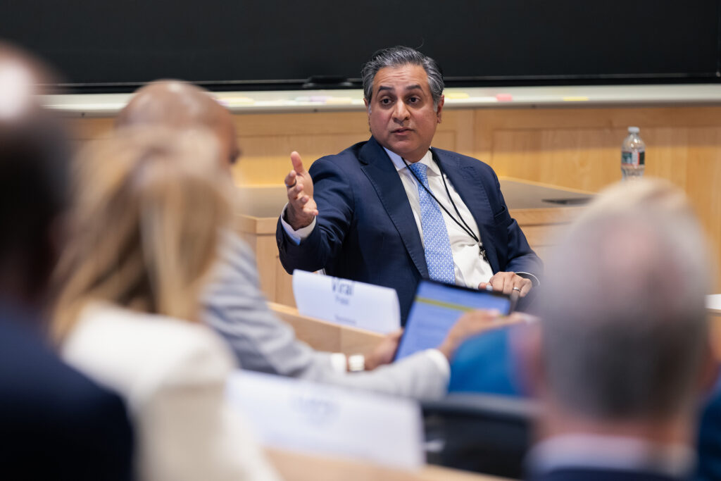 Viral Patel speaks in a classroom.
