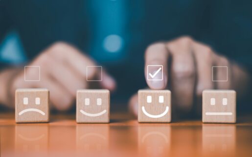 Selecting a satisfaction score by selecting a smiley face.